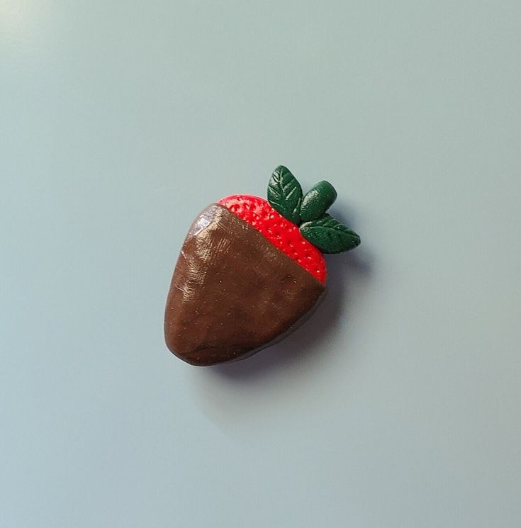 a chocolate covered strawberry sitting on top of a table