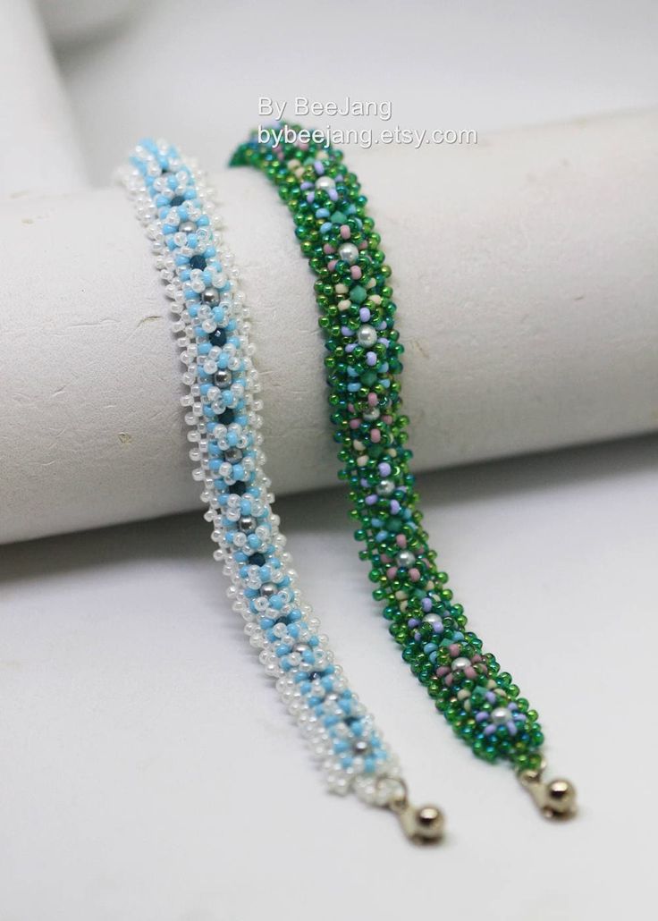 two bracelets with pearls and beads on top of each other