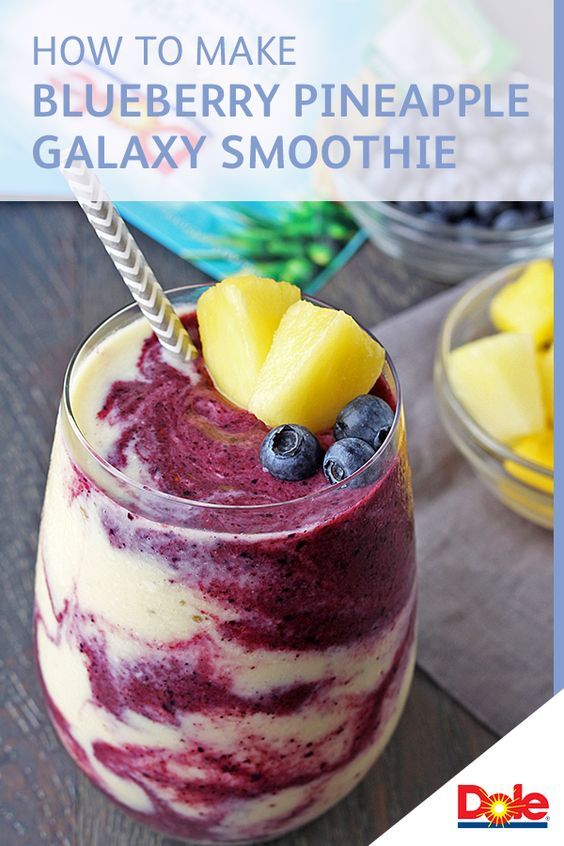 a glass with some fruit in it on a table