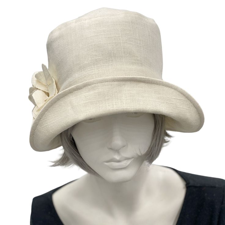 Handmade in the USAA hat isn't just about fashion, though the bespoke hats found here at Boston Millinery are the height of vintage style, it's about how you feel.It's about finding that finishing touch that make the corners of your lips uptick into a smile that shares your confidence and creativity.Wear this lovely Eleanor cloche hat to a garden party, the horse races, or an afternoon wedding and you’ll appear just as chic as Mary on Downton Abbey in today’s 20s. Meticulously crafted with care, Fitted Cream Panama Hat With Short Brim, Chic Fitted Hats With Curved Brim, Chic Fitted Hat With Curved Brim, Cream Fitted Sun Hat With Flat Brim, Fitted Brimmed Cream Hat, Fitted Cream Brimmed Hat, Fitted Cream Fedora For Spring, Vintage Style Fitted Beige Fedora, Fitted Vintage Beige Fedora