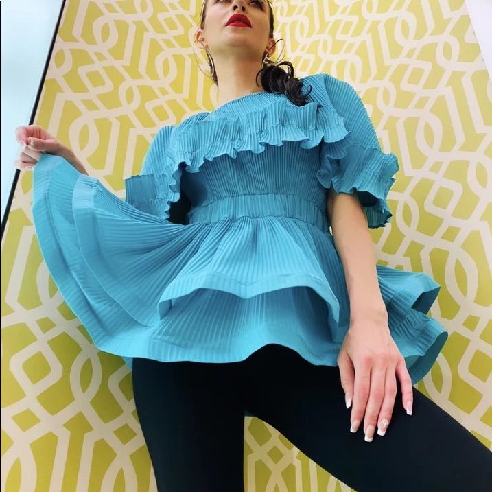 This Very Versatile Ruffle And Bounce Top Promises A Chic Look You Can Wear Day Or Night. Made With Exquisite Fabric. Blue Pleated Summer Tops, Blue Pleated Tops For Summer, Fitted Light Blue Ruffled Blouse, Chic Look, Top For Women, Woman Colour, Color Blue, Top Blouse, Blouses