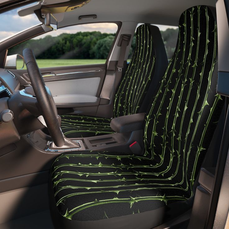 the interior of a car with green and black lines on it's seat covers