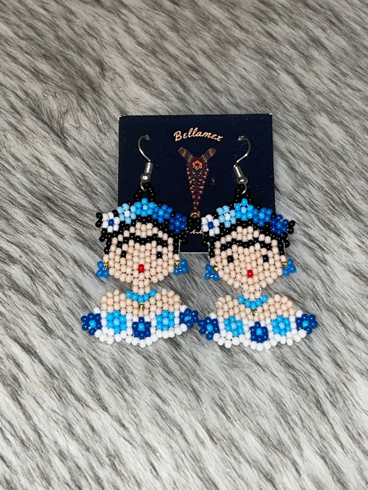 the beaded earrings are designed to look like cartoon characters