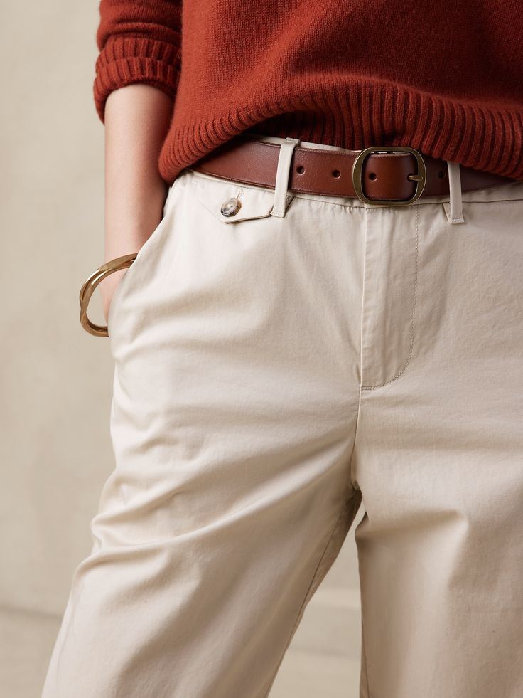 Effortlessly sophisticated with a relaxed silhouette and roll cuffs, this incredibly soft chino pant is designed to suit many tastes: size down for a higher rise and figure-hugging fit, or take your regular size for a slouchy, highly relaxed take on Spring Ankle-length Chinos For Everyday, Everyday Ankle-length Chinos For Spring, Classic Tapered Chinos For Fall, Classic High-waisted Everyday Pants, Chic Cotton Chinos With Tapered Leg, Elegant Chino Cotton Twill Bottoms For Work, Solid Chinos With Straight Hem For Everyday, Elegant Chino Cotton Twill Workwear Bottoms, Solid Straight Hem Chinos For Everyday