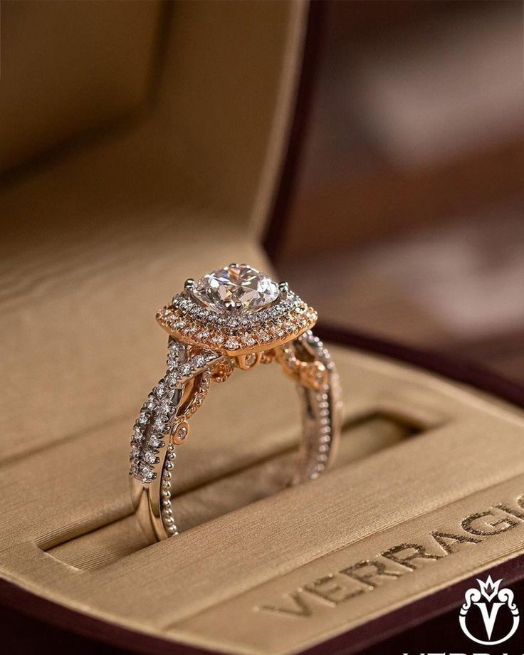 an engagement ring in a box with the words verago written on it