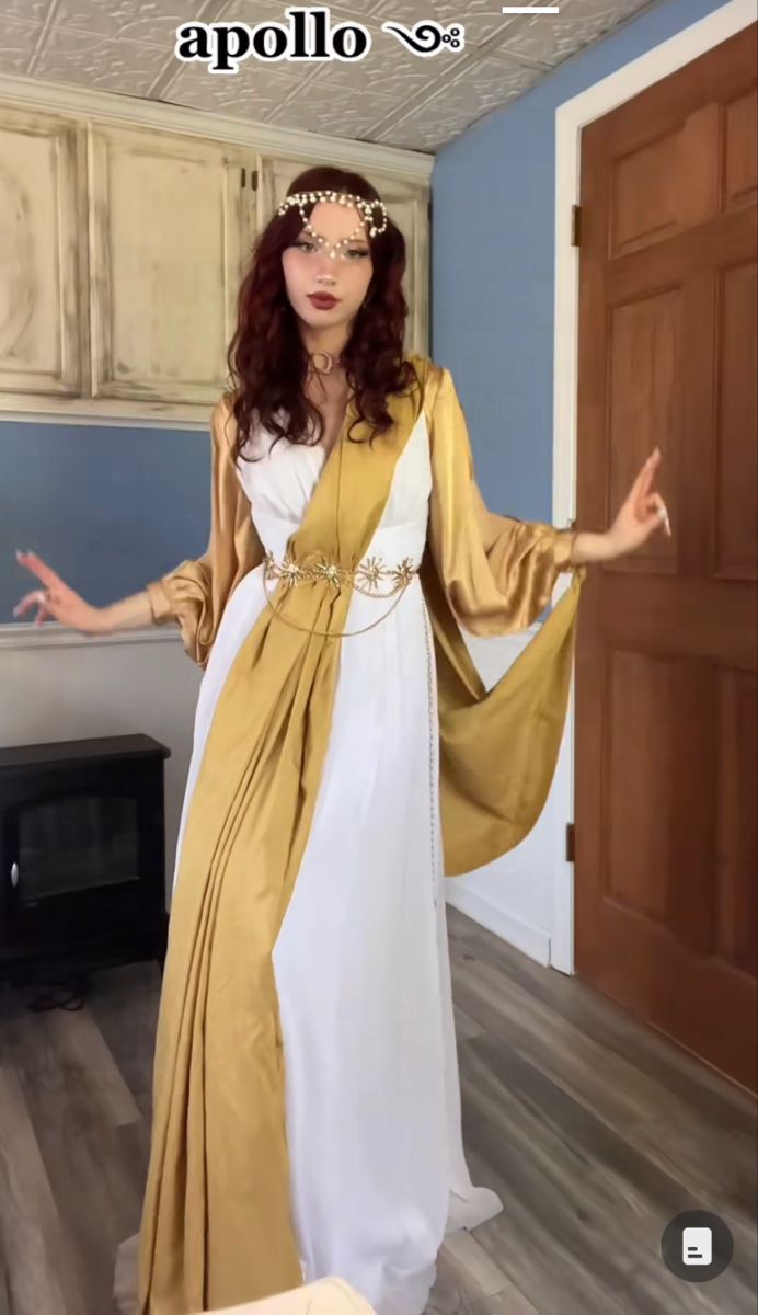 a woman dressed in an ancient greek costume with her arms outstretched and hands out to the side