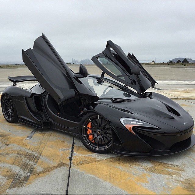 a black sports car with its doors open