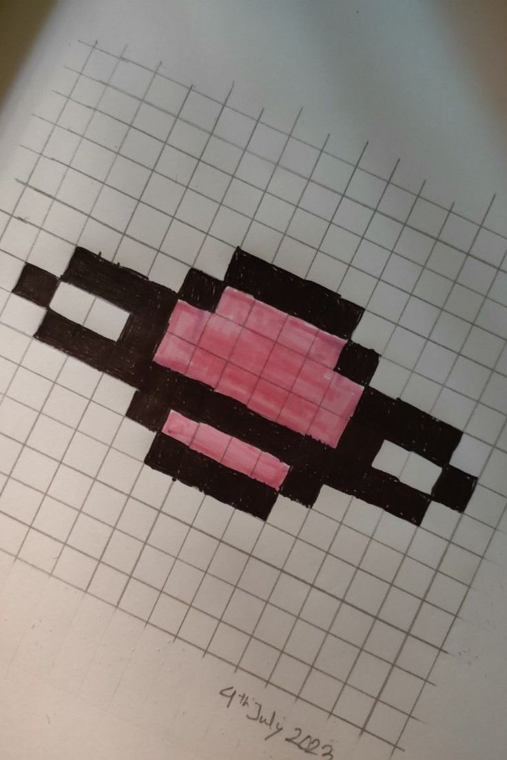 a piece of paper that has some type of object drawn on it with graph paper