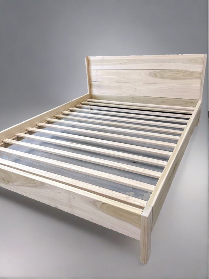 the bed frame is made from wood and has no headboard or foot board on it