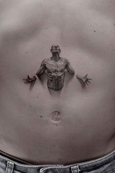 a man's stomach with an image of a human being on the side and hands coming out from his chest