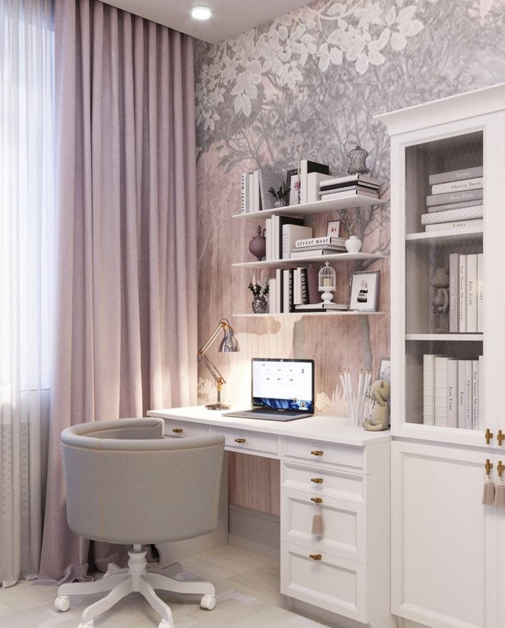 a white desk with a laptop computer on top of it next to a book shelf