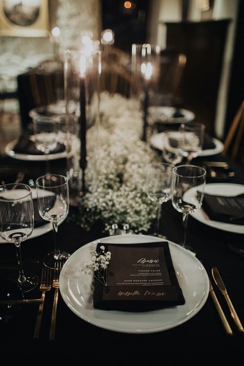 a table set with place settings for dinner