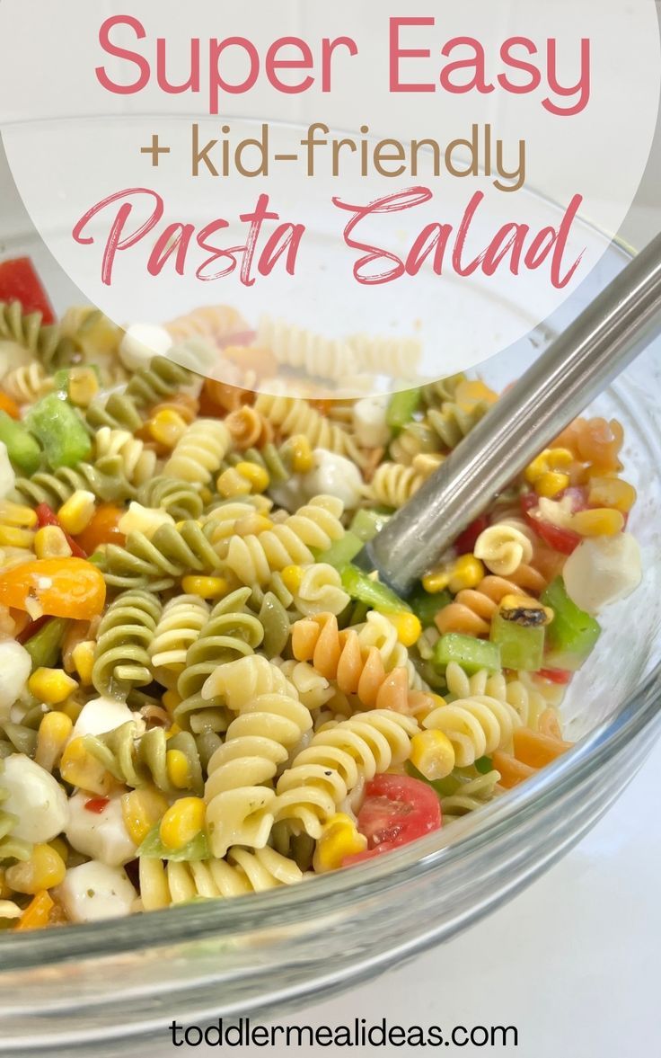 a bowl filled with pasta salad and the words super easy kid - friendly pasta salad