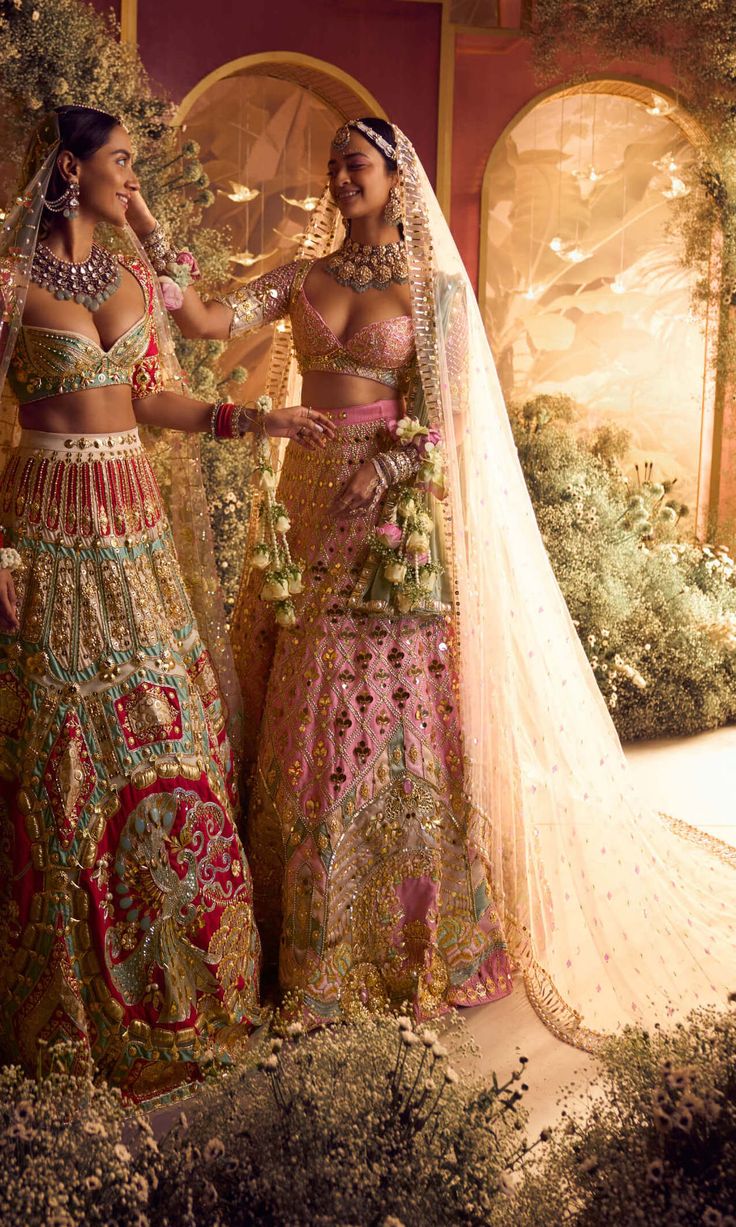 Introducing our royal carriage bridal lehenga set - a regal masterpiece. Embroidered with crystals, gold tassels, beads, and 3d floral motifs, it features custom initials for a personal touch. Paired with a baby pink and teal blouse, delicate tassels, and bangle back. Completed with embroidered pink tulle and fluid organza dupattas. Baby Pink Bridal Lehenga, Royal Carriage, Pink Bridal Lehenga, Desi Dress, Traditional Indian Dress, Teal Blouse, Indian Dresses Traditional, Traditional Indian Outfits, Desi Clothes