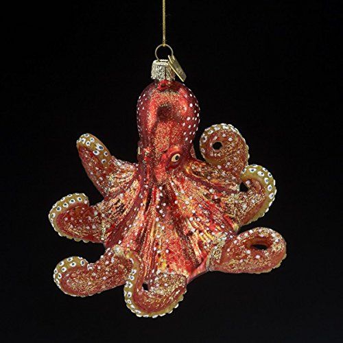 an octopus ornament hanging from a string on a white background, with red and gold accents