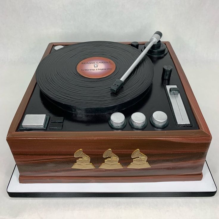 a wooden record player with three knobs on it's turntable and cover