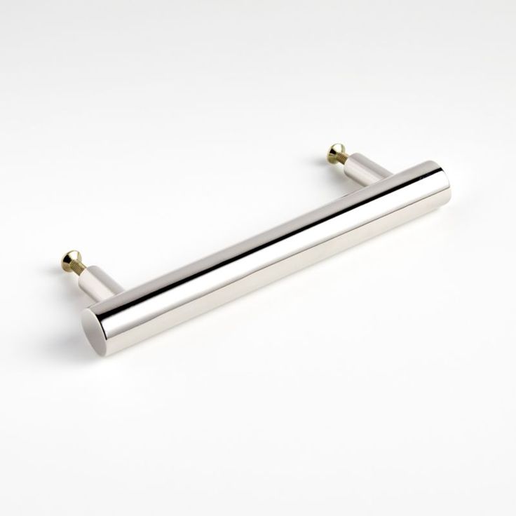 a pair of stainless steel towel bars on a white surface with two gold - plated handles