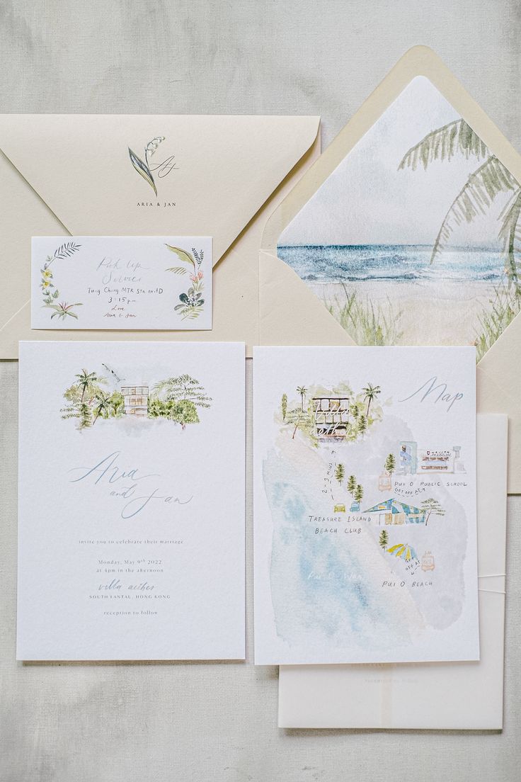 the wedding stationery is laid out on top of each other