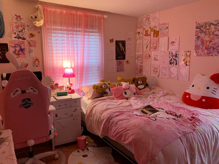 a bedroom with hello kitty decorations on the walls and pink bed linens in it