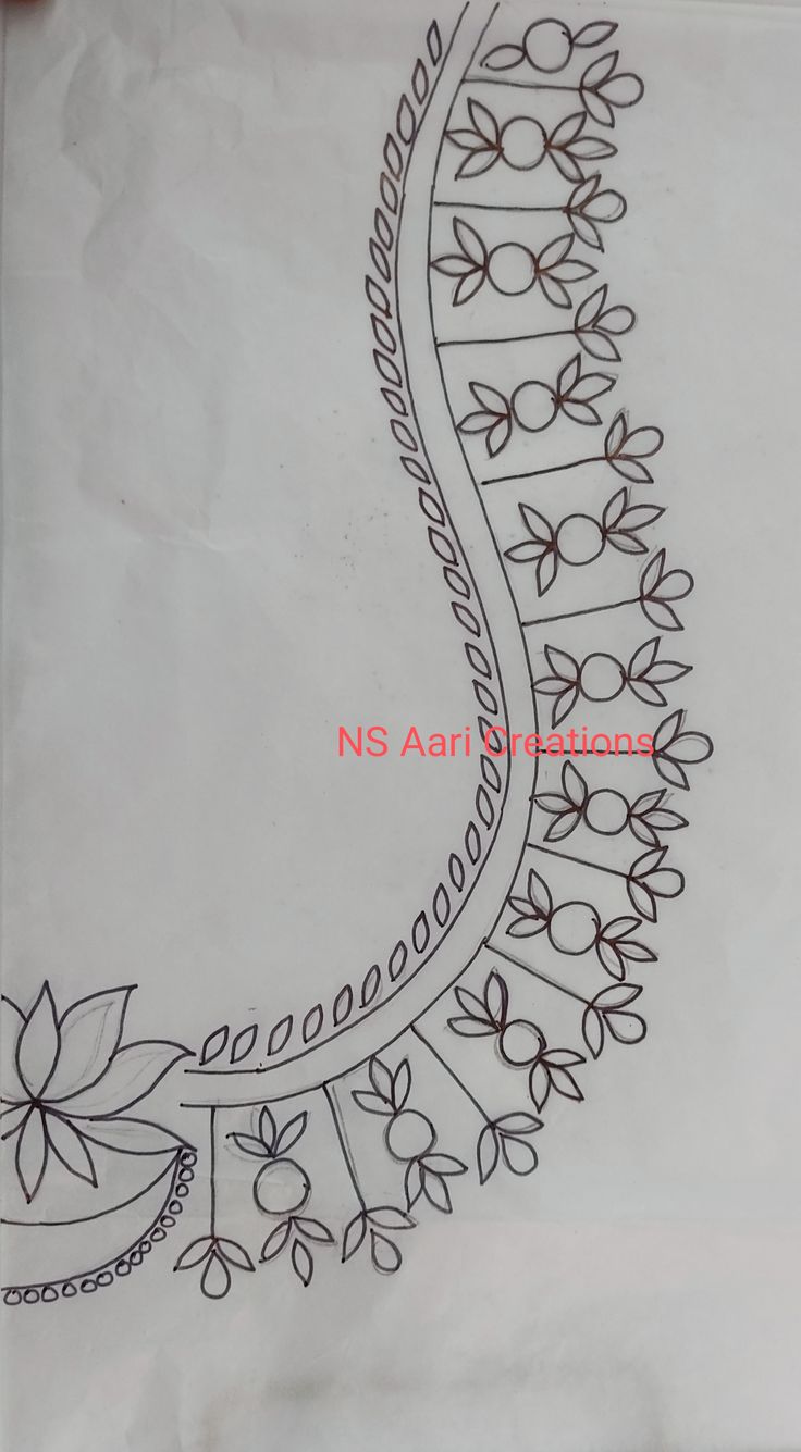 an embroidered piece of cloth with flowers and leaves on the side, in black ink