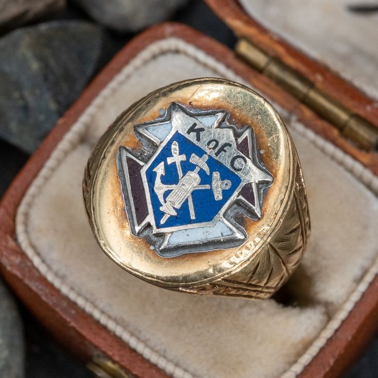 This attractive antique Knights of Columbus ring features a red, white, and blue enamel crest. The shoulders are beautifully hand engraved and the ring has the dates "9-25-24" and "11-23-24" engraved inside the shank. The ring is crafted of 14k yellow gold. Classic Enamel Hallmarked Rings, Classic Engraved Enamel Jewelry, Antique 14k Gold Signet Ring Collectible, Antique 14k Gold Signet Ring For Commemoration, Heirloom Collectible 14k Stamped Signet Ring, Heirloom 14k Gold Signet Ring For Commemoration, Antique Enamel Ring Collectible, 14k Gold Heirloom Signet Ring For Commemoration, 14k Gold Engraved Signet Ring Collectible