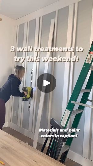 a woman is painting the walls in her home