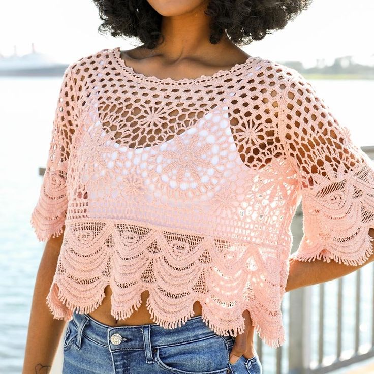 Get ready to turn heads in this stunning Crochet Crop Top. Perfect for those hot summer days, this top is designed to keep you cool and stylish. The beautiful scalloped details give it a sophisticated and high-end look, making it a versatile piece for both casual and dressy occasions. Pair it with high-waisted shorts or a flowy skirt for a flirty and feminine look. Whether you're hitting the beach, going for a night out, or just enjoying a sunny day, this top will elevate your outfit and have yo Summer Crochet Lace Top For Vacation, Summer Lace Trim Crop Top, Summer Beach Lace Top With Crochet Trim, Summer Crop Top With Lace Trim, Summer Vacation Crop Top With Lace Trim, Crochet Trim Lace Top Summer, Crochet Trim Lace Top For Summer, Casual Summer Crochet Lace Top, Summer Beach Lace Top