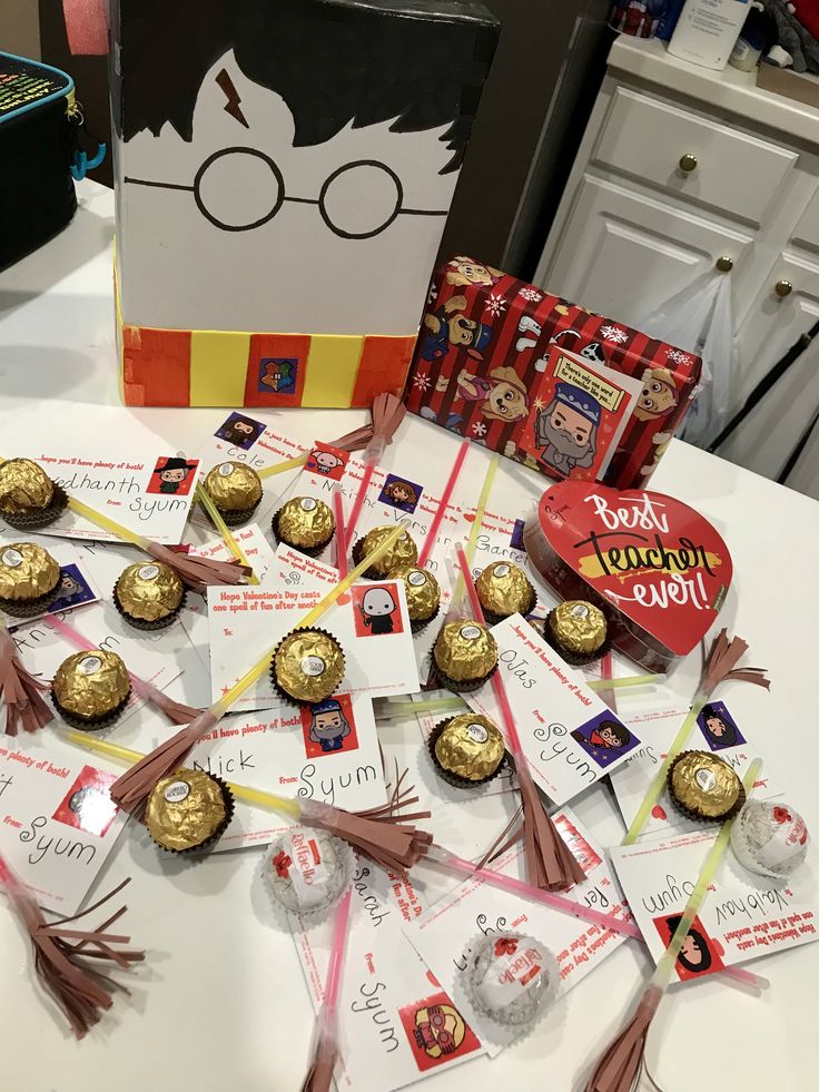 harry potter chocolates are arranged on a table in front of a box and some candy