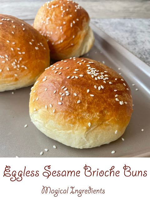 three sesame - brioche buns on a baking sheet with text overlay