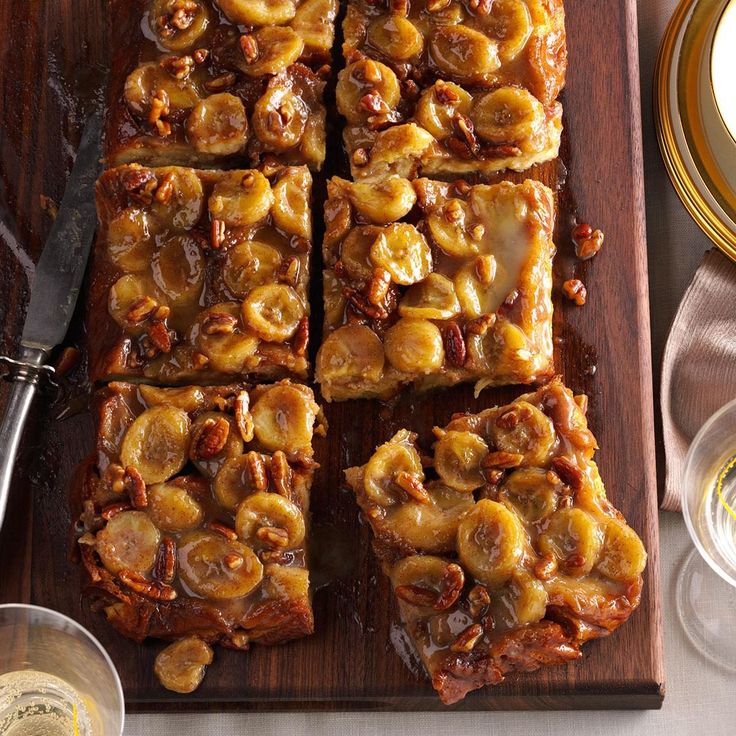 sliced bananas and pecans on a wooden cutting board