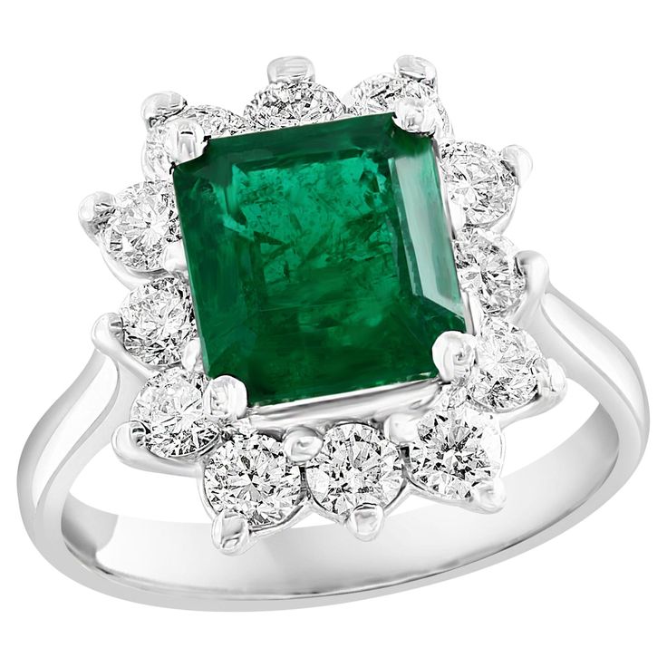 A stunning well-crafted engagement ring showcasing a 3.17-carat certified emerald-cut vivid green emerald. Flanking the center diamond are perfectly matched brilliant cut 12 diamonds weighing 1.20 carat in total, set in a polished 14K White Gold mounting. Handcrafted in our New York City workshop. Green Emerald is approx 9.05 x 8.41 x 5.66 mm. Style is available in different price ranges. Prices are based on your selection. Please contact us for more information. Graduation Nails, Nails White, Emerald Diamond Ring, American Modern, Square Nails, Green Emerald, Emerald Diamond, Jewelry Rings Engagement, White Nails