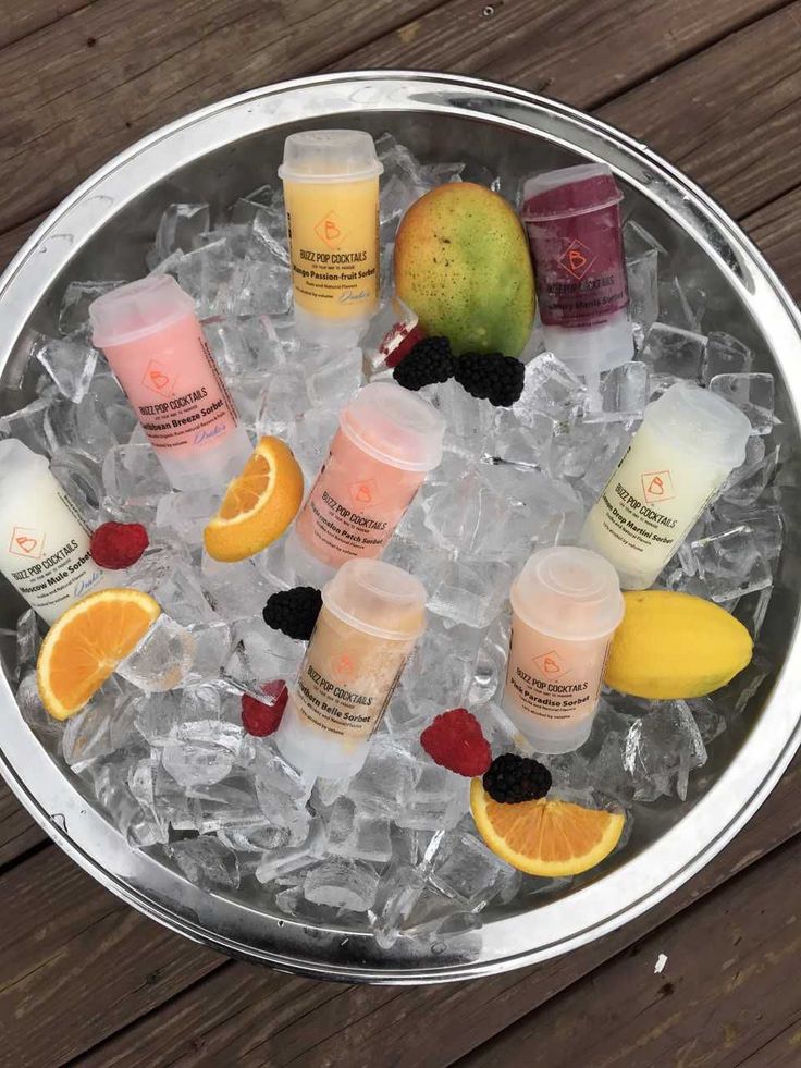 a metal bowl filled with lots of different types of skin care products on top of ice