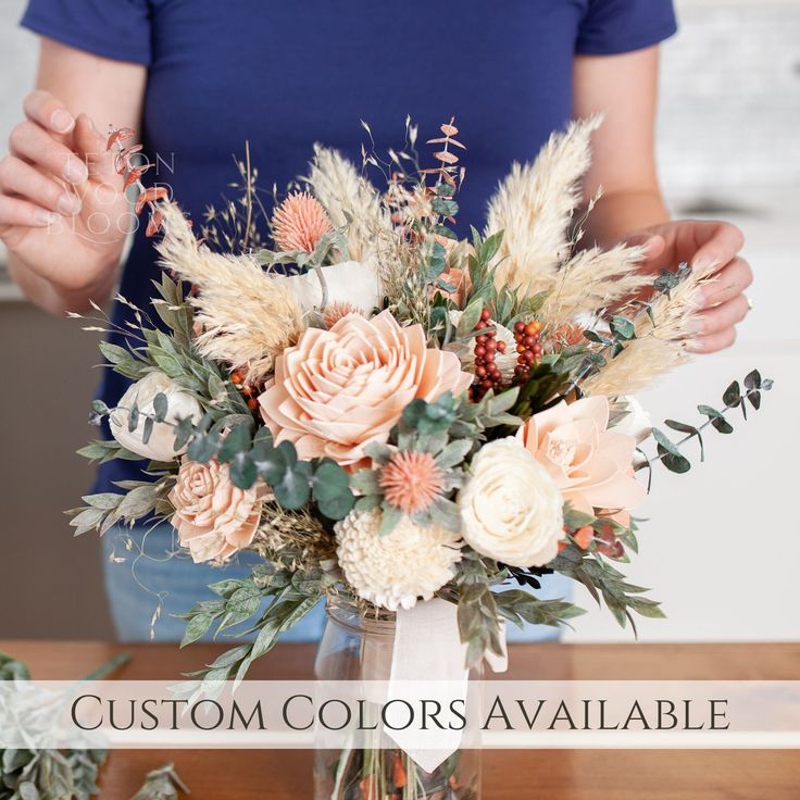 a woman arranging flowers in a vase with the words, custom colors available on it