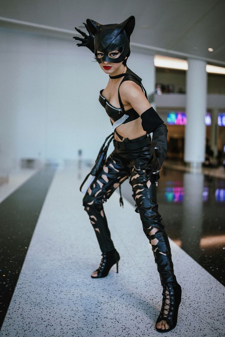 a woman dressed in catwoman costume posing for the camera