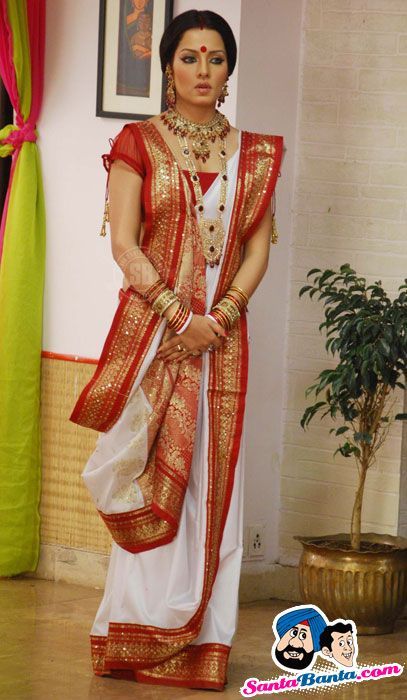 a woman in a red and white sari