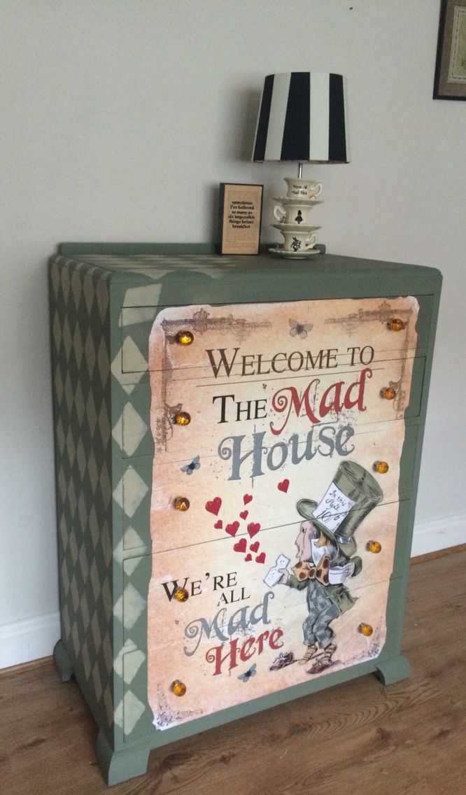 a welcome sign is on top of an old fashioned cabinet in the corner of a room