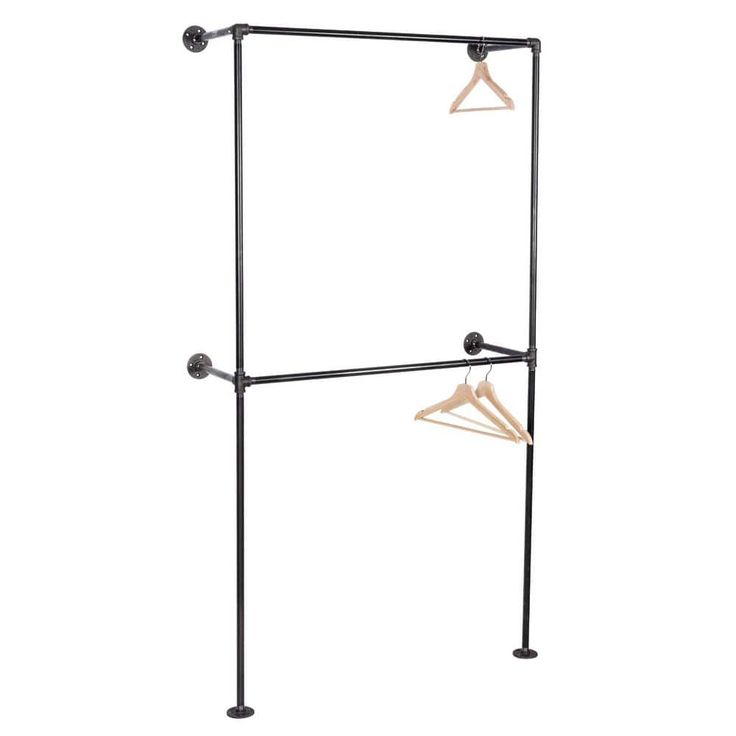 an iron and wood garment rack with three hangers