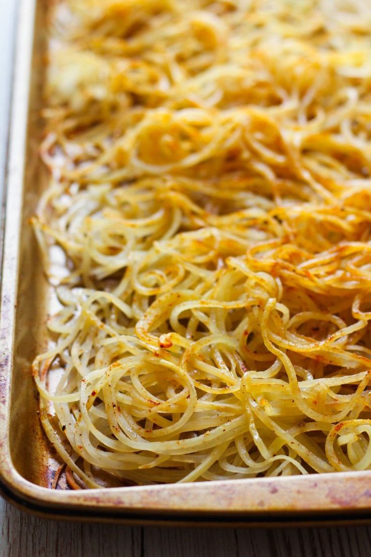 a casserole dish filled with noodles and cheese