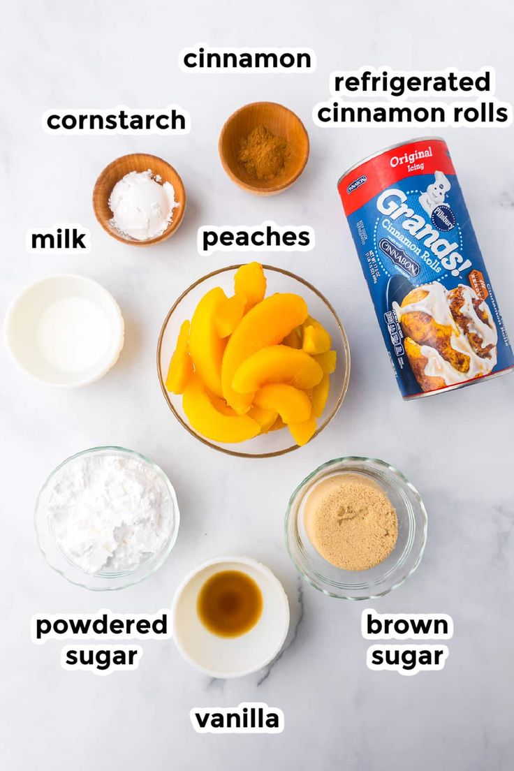 ingredients to make peach cobbler on a white marble countertop with text overlay