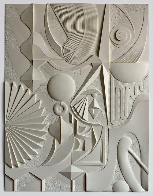 an intricately designed paper sculpture is shown