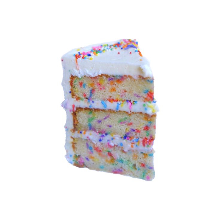 a slice of cake with white frosting and sprinkles on it is shown