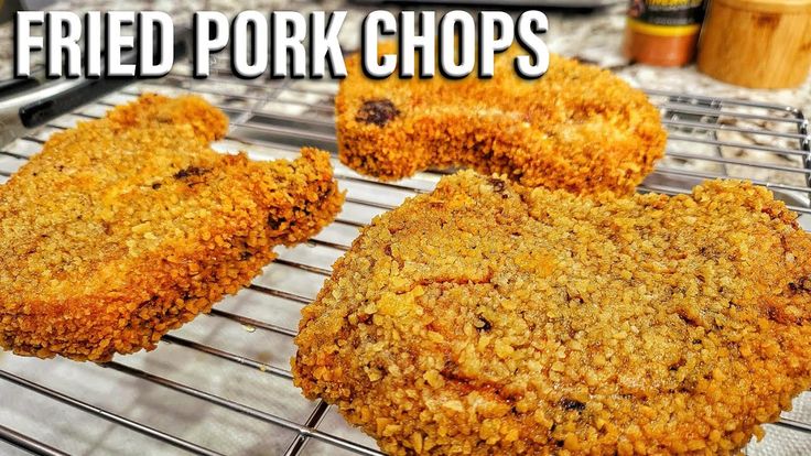 fried pork chops are cooling on a rack with the words fried pork chops