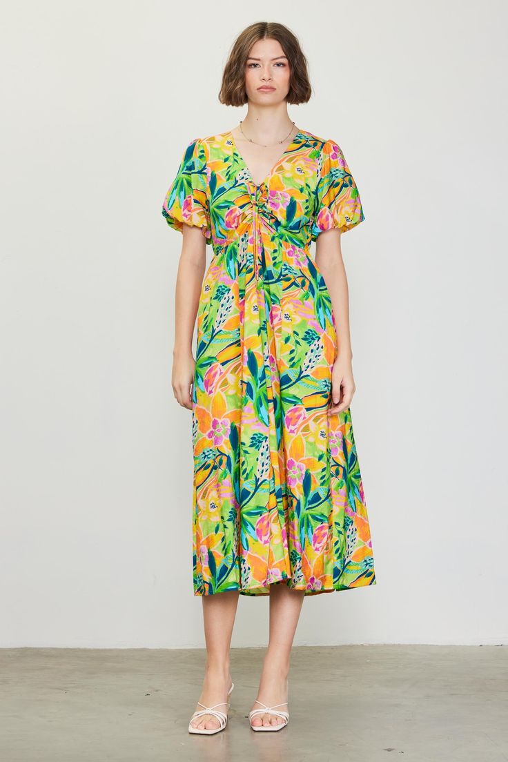 A color palette of mood-boosting brights enlivens this floral-printed midi dress. Framed by voluminous bubble sleeves, it's got a V-shaped neckline with tie detailing that lets you adjust the fit of the bodice. •V-shaped neckline •Adjustable tie detailing •Short bubble sleeves •Elasticized back waist •Mid-length hem Item Number: 99794 Tropical Print V-neck Midi Dress For Garden Party, Spring Floral Maxi Puff Sleeve Dress, Vibrant V-neck Midi Dress For Brunch, Vibrant Multicolor Print Midi Dress For Spring, Green Tropical Print Midi Dress For Garden Party, Spring Multicolor Floral Dress With Puff Sleeves, Multicolor Floral Puff Sleeve Dress For Spring, Vibrant Green Maxi Dress For Spring, Spring Tropical Print Midi Floral Dress