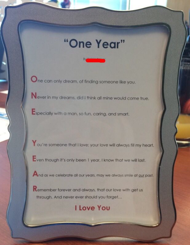 a one year poem is displayed on a table