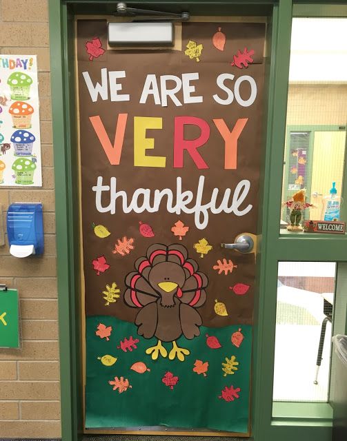 a classroom door decorated with a turkey saying we are so very grateful