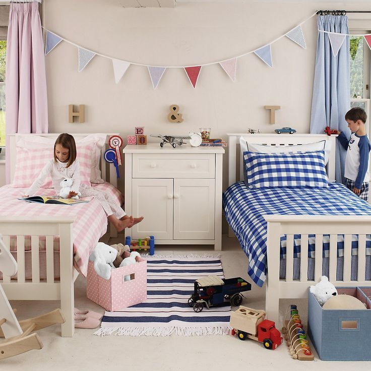 two children are playing in their bedroom