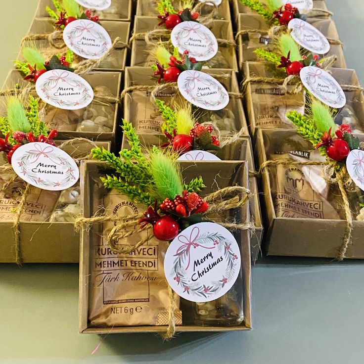 several boxes filled with different types of christmas decorations on top of a table next to each other