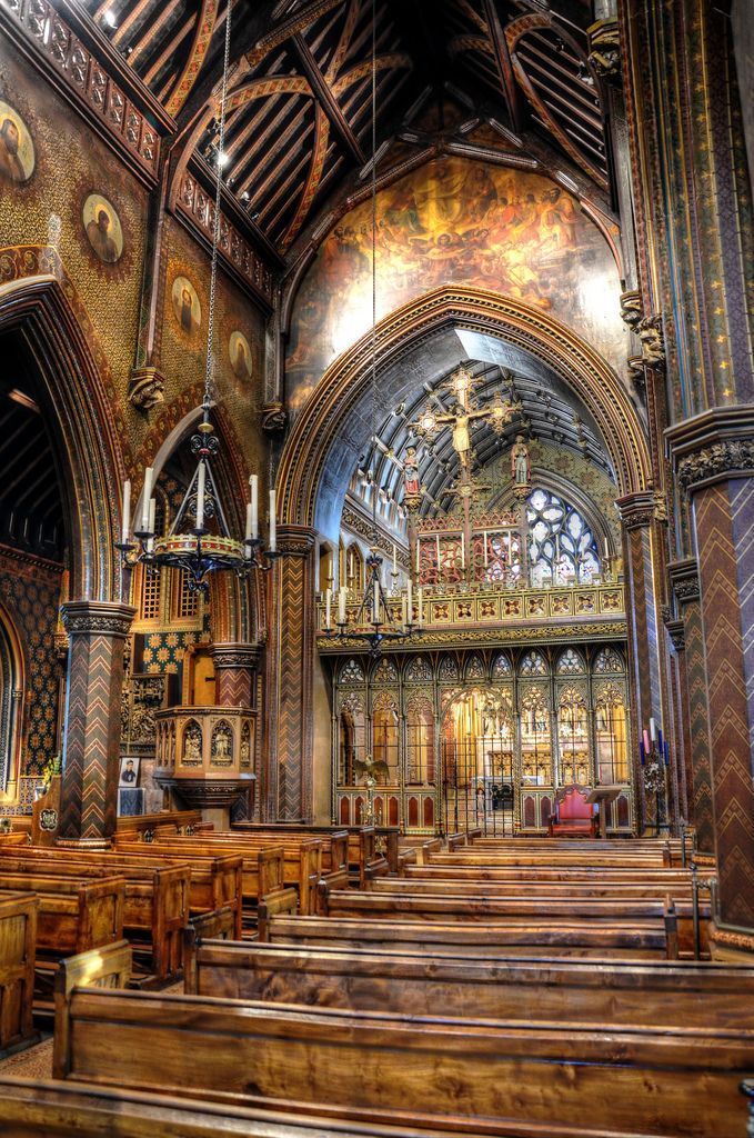 the inside of an old church with wooden pews