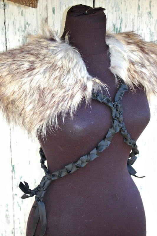 a mannequin with fur and chains on it