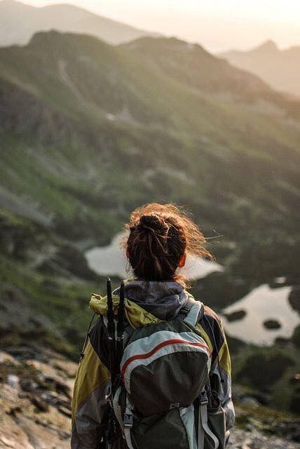 a person with a backpack looking out over a mountain range and the words hike above them